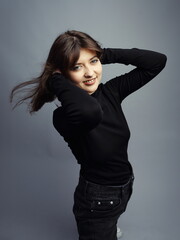 Happy Young Woman Smiling with Hands Behind Head