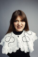 Fierce Snarling Woman Baring Teeth in Intense Portrait