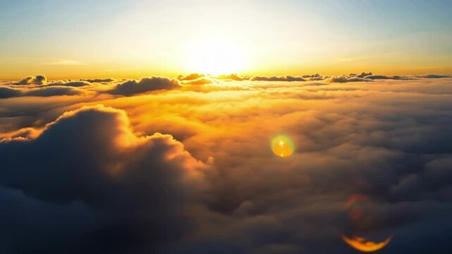 Camera moves smoothly above fluffy golden clouds during spectacular sunrise or sunset creating ethereal heavenly atmosphere with warm orange and yellow light rays breaking through