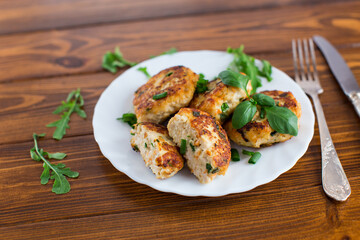 Crispy chicken cutlets for dinner close-up on a wooden table