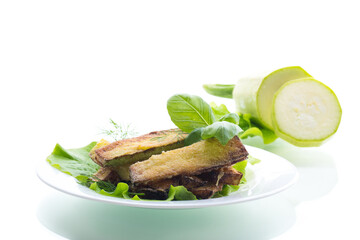 Golden fried zucchini on a white background
