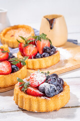 Sponge mini tart cakes with summer berry