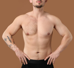 Fototapeta premium Man showing chest before and after epilation procedure on brown background, closeup