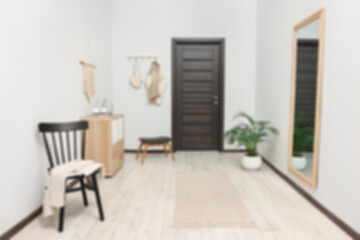 Hallway with furniture and door, blurred view
