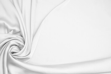 Texture of white silk fabric as background, top view