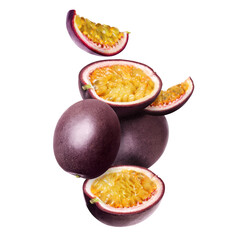 Delicious ripe passion fruits falling on white background