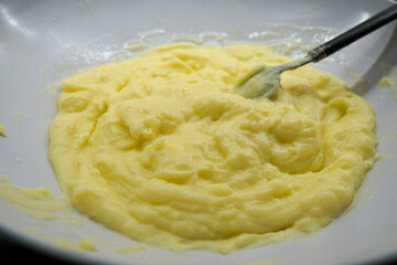 Making creamy custard at home. Homemade custard