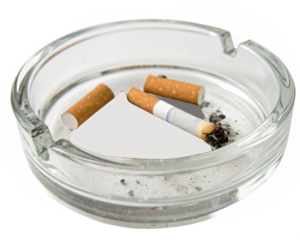 Transparent glass ashtray with discarded cigarette remnants, isolated PNG transparent background