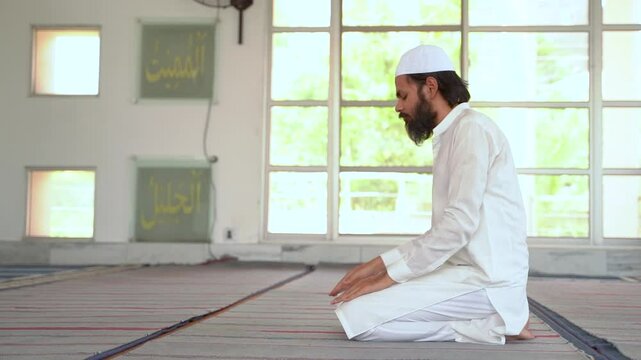 Peaceful sujood: Muslim man prays devoutly in a mosque. Spiritual connection and faith.