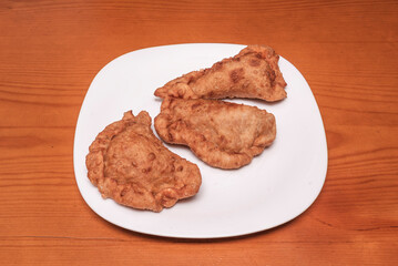 hether it's a Galician cod empanada, a juicy Bolivian salteña