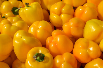 Vibrant collection of yellow bell peppers, showcasing freshness and ideal for healthy cooking....