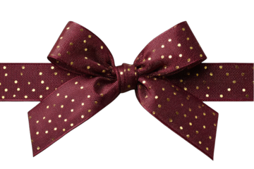 A burgundy ribbon with gold polka dots forms a gift bow