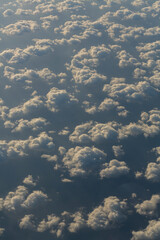 Stratosphere, view of water through clouds. Seascape, view from above, from an airplane window.