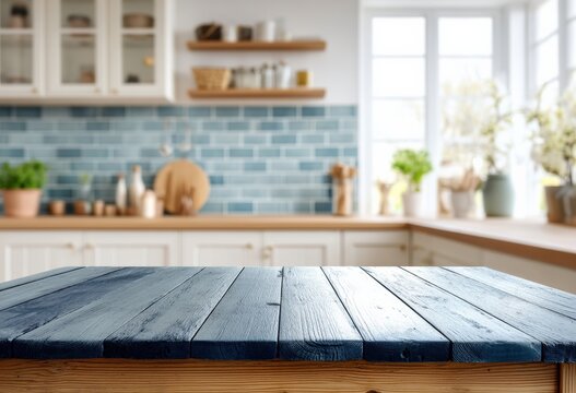 Fototapeta Empty wooden table set against a softly blurred, bright kitchen featuring blue tiles, perfect for showcasing products or mockups