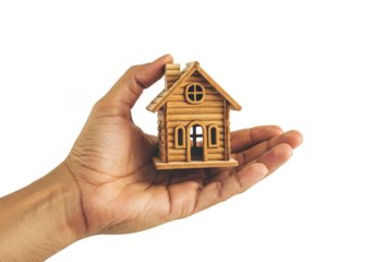 Hand Holding Miniature Wooden House for Real Estate Investment PNG