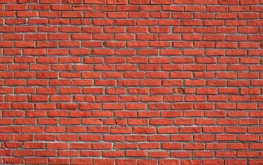 Uniform red brick wall texture creating a solid and striking backdrop, featuring ample copy space for various design needs