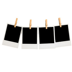 Four Blank Instant Photos Hanging on a String with Wooden Clothespins on a Black Background Ready for Your Images