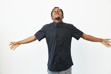 Black man expressing joy with open arms, showcasing happiness and freedom. A powerful...