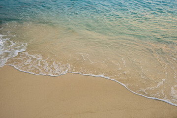 Nature of the beach and sea Summer with sunshine, sandy beaches, clear blue waters sparkling against the blue sky. On an island with good ecology and environment Background for summer vacation