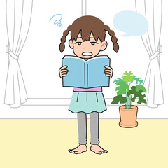 居間でいやいや教科書を音読する女の子