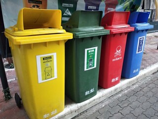 Colorful Waste Separation Bins for Recycling and Hazardous Waste Management