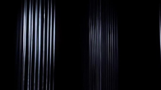 Vertical lines white and dark create a textured abstract pattern