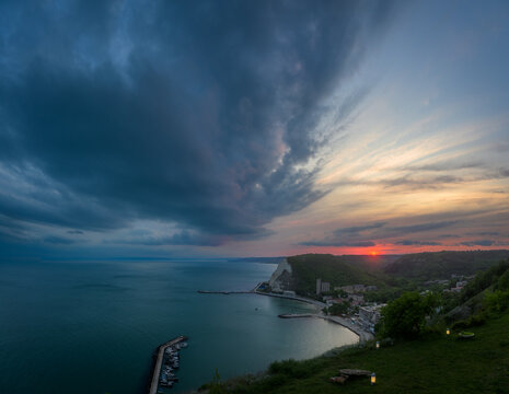 storm clouds at sunset over the sea cliffs and the Chirakman hill