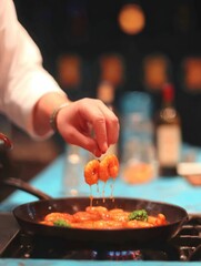 Chef preparing sauteed shrimp