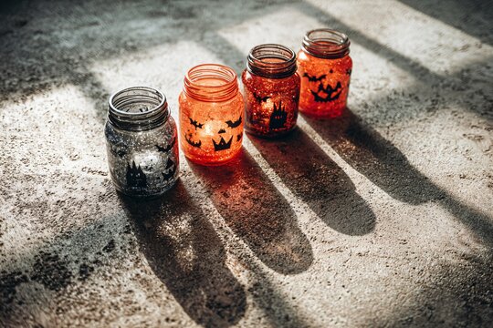 Halloween Themed Mason Jars Display Indoor Decor Glassware Shadow Play Festive Atmosphere