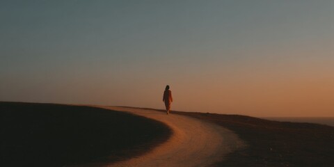 Obraz premium Minimalist career coaching concept with solitary figure walking on arrow-shaped path at sunset, symbolizing growth and professional advancement
