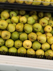 Rows of fresh, green and yellow pears at the market, top view,Hileras de peras frescas, verdes y amarillas en el mercado, vista superior, (18)