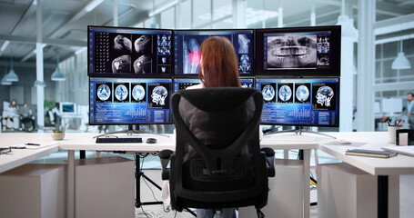 Neurology Doctor Using Radiology Monitoring Computer