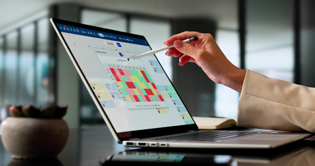 Female Analyst Utilizing Heatmap Analytics On Laptop
