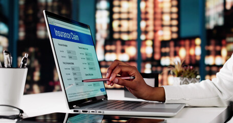 Woman Filing Online Insurance Application For Life Policy