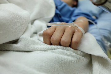 hand giving saline solution