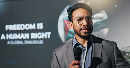 Man, speaker and mic at conference event of conflict, freedom and human rights speech. Person, public speaking and raise awareness for global oppression, stop injustice and action for Palestine peace