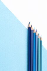 colored pencils on a white background