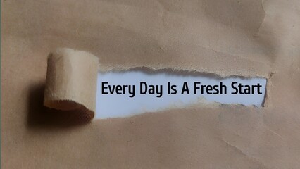 Every Day Is A Fresh Start - Motivational Message Revealed Through Torn Brown Paper
