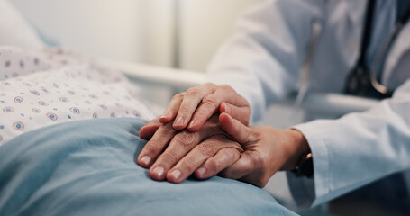 Holding hands, healthcare and patient in hospital, doctor and compassion with empathy. Closeup, sick and medical professional with person, sympathy and wellness with diagnosis, hope and kindness