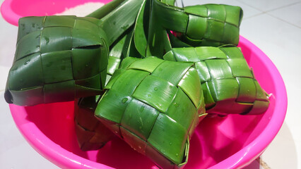 
Ketupat (Rice Dumpling) On White Background. Ketupat is a natural rice casing made from young coconut leaves for cooking rice during eid Mubarak, Eid Fitr