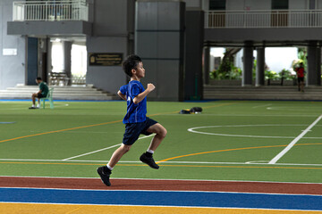 the boy is practicing running.