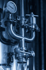 Industrial Valve Mechanism with Pressure Gauge in a Modern Facility