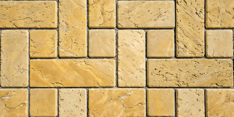 Golden yellow travertine tiles in mixed rectangular pattern, warm honey-colored natural stone with characteristic porous texture and organic veining.