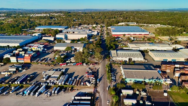 Carole Park and Wacol, Queensland, Australia: Aerial Image of Industrial Warehouses, Distribution Centres, Road Network, and Logistic Hubs with Distant View of Brisbane CBD Skyline