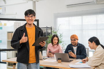 Fototapeta premium Asian business start up freelance people team analyzing statistics financial. Group Team of businesspeople man and woman Meeting Conference Discussion various topic Corporate Concept in office.