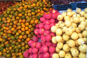Fresh Oranges, Apples, and Pears at the Traditional Market
