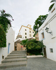Streets and views of the ancient walled citadel of Dalt Vila, a UNESCO World Heritage Site, on the island of Ibiza in Spain.