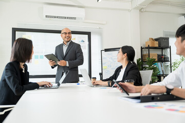 Asian business people team analyzing statistics financial. Group Team of ceo business man and woman Meeting Conference Discussion various topic. Executive professional managers Corporate in office.