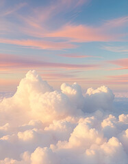Dreamy vertical cloudscape with soft, fluffy clouds bathed in warm pastel tones of pink, peach, and blue. Peaceful sky scene ideal for backgrounds, relaxation themes, or design use