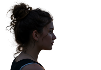 Portrait of a young woman with bun hairstyle against a black background looking to the right side view on transparent background